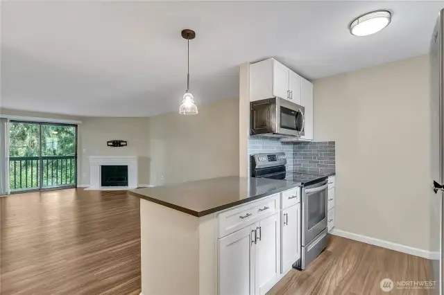 Kitchen with Bar and Open to Living Area