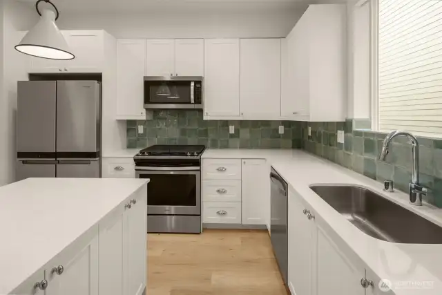 Fabulous kitchen layout with pretty tile backsplash