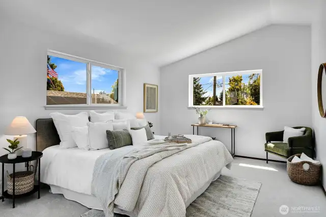 Large, sunny primary with vaulted ceilings.