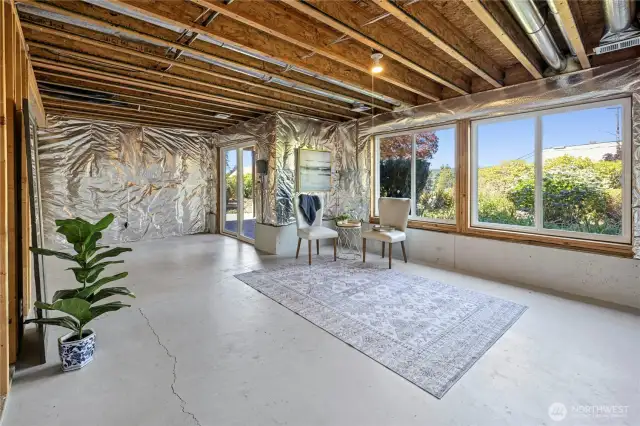 Lower level is partially finished. Full height 8ft ceilings, duct work...just waiting for drywall and flooring. How would you finish off this lower level?
