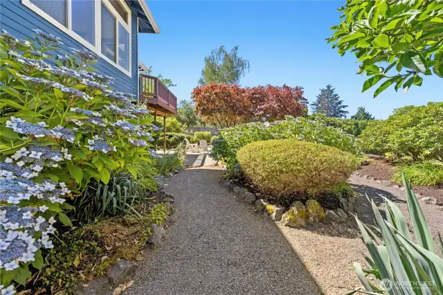 Mature plantings and lovely garden pathways. This is a lovely outdoor retreat with a 7-zone sprinkler system