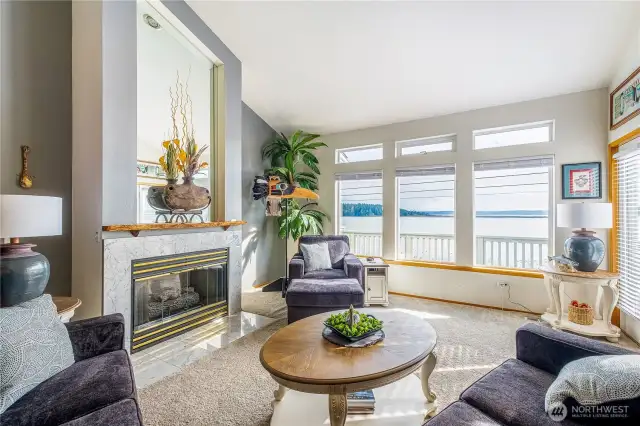 Full views of the marina and harbor from floor to ceiling windows and southern facing light. High, vaulted ceilings frame the large, comfortable living room.