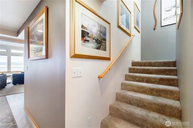 Upstairs is the primary and guest bedrooms with two bathrooms.