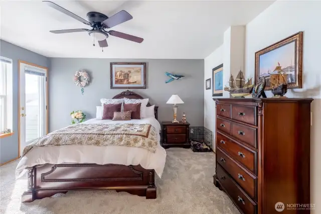 The primary bedroom is the perfect place to rest and relax.
