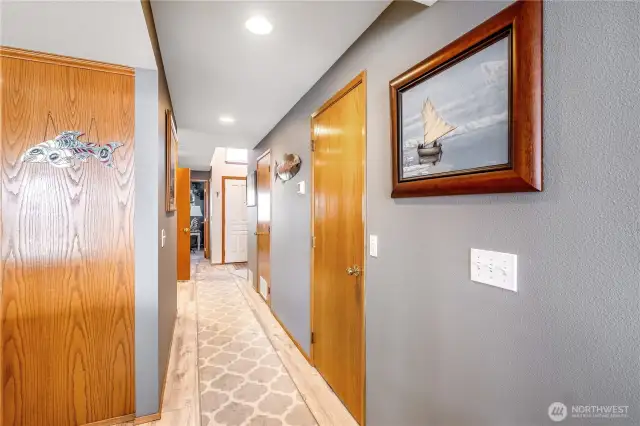 Large kitchen pantry in the hallway leading to the main entrance of the home. Plenty of room for art.