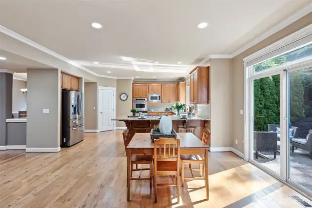 The sliding door provides light and convenient access to the fenced yard.