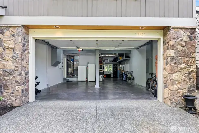 3- car finished garage with new furnace, new water heater, and plenty of storage.