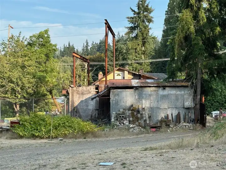 Shed inside of the fenced area, steal beams are the part of the collapsed house