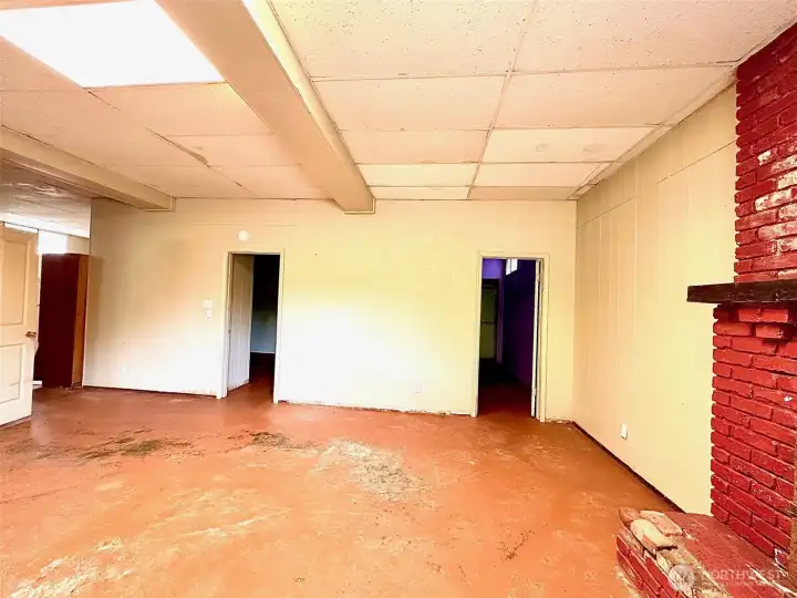 Lower level living room showing doors to bedrooms.