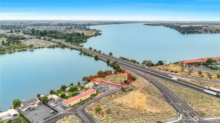 Aerial view showcasing prime waterfront commercial lot in Moses Lake