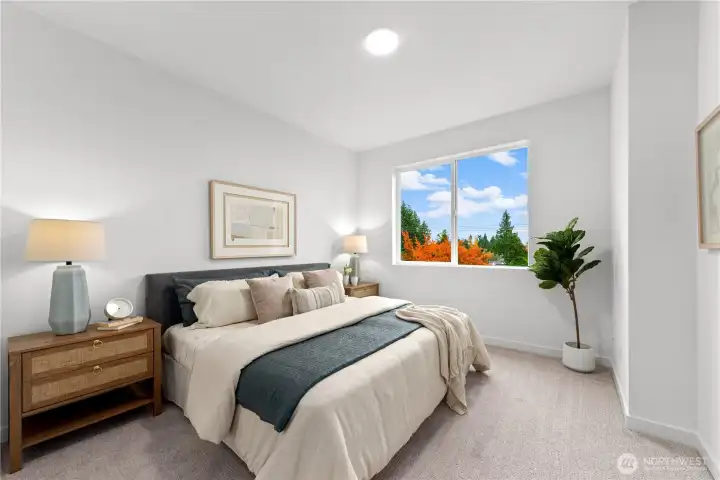 The primary bedroom perfectly fits a king-size bed