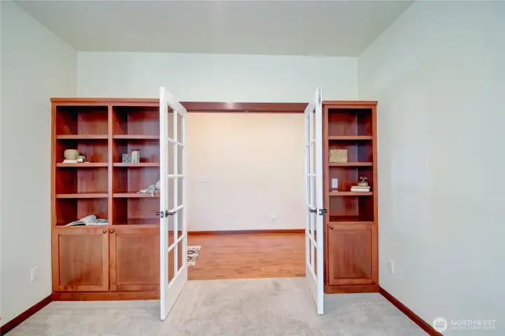 Built-in bookcases and french doors.