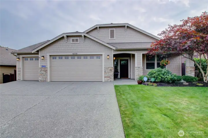 Front view with a 3-bay garage for your cars and storage.
