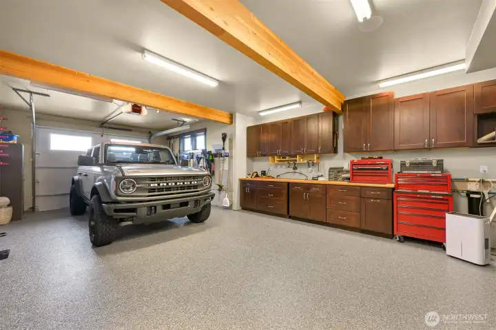 Lower level tandem garage with workshop