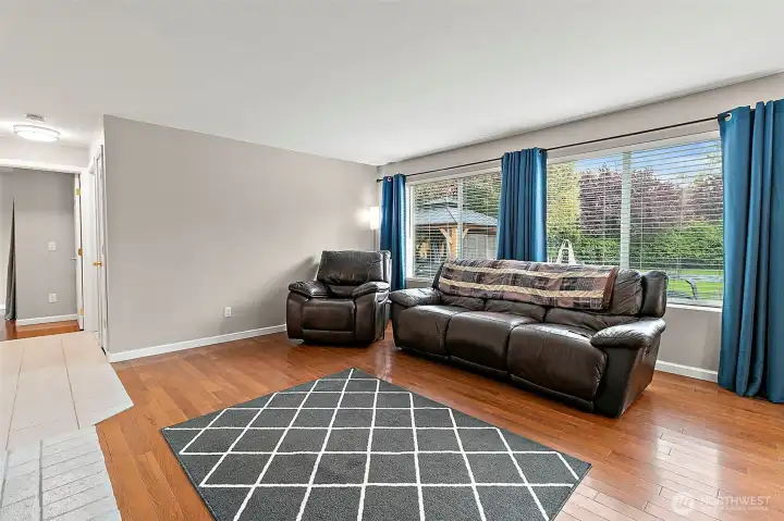 Lot of natural light throughout the home. Hallway to the left goes to the downstairs bedrooms.
