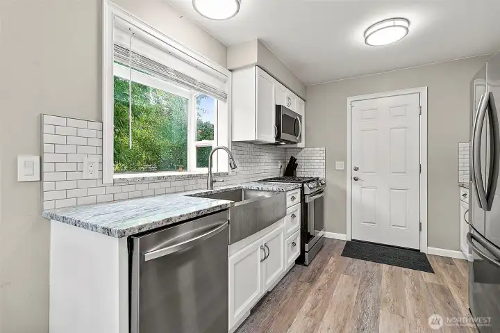 Updated kitchen with stainless appliances and quartz counters.