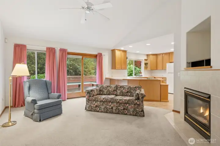 Cozy family room just off the kitchen. Access to the fenced backyard thru the door.