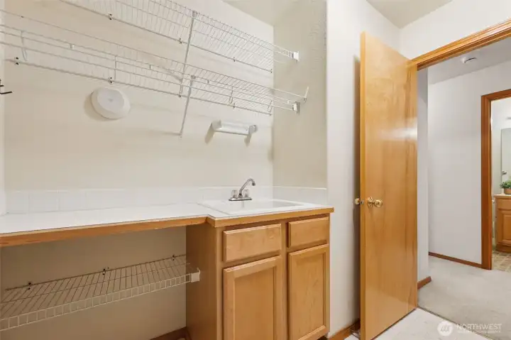 Large utility room offers plenty of storage space.