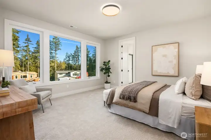 Guest suite on main with 3/4 attached bath Photo is of our previous furnished Model Home in phase 1