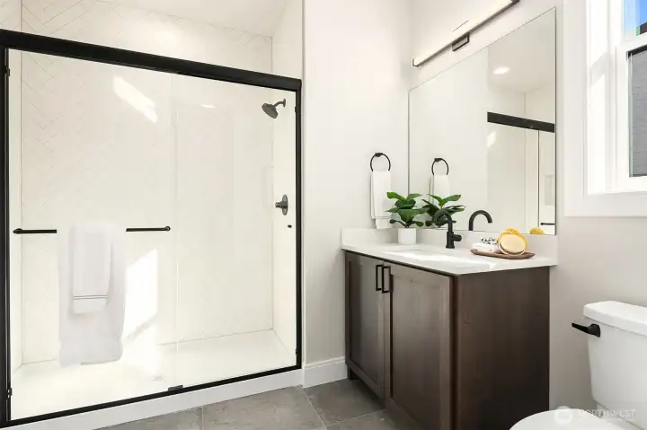 3/4 bath attached to main floor guest suite.Photo is of our previous furnished Model Home in phase 1