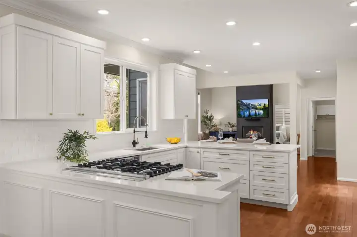 Newly remodeled kitchen with sleek quartz countertops and an abundance of storage.