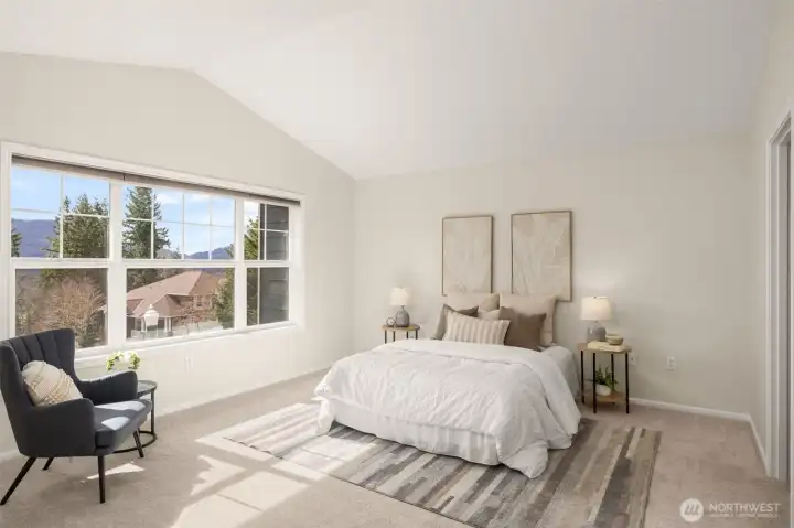 Primary suite upstairs has a scenic view of the mountains