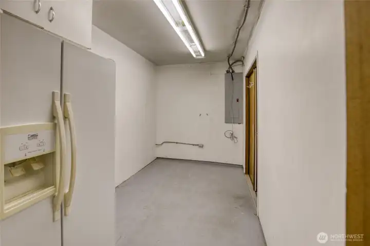 Room for shelving and extra refrigerator