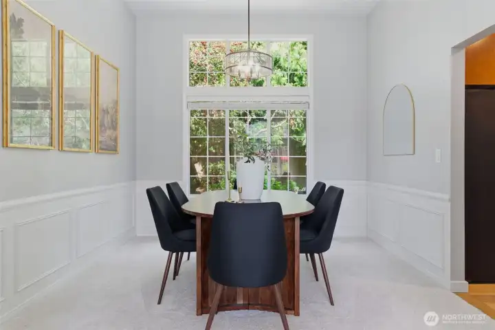 Light-filled dining room with large windows, and plenty of space for everyday meals or hosting friends!