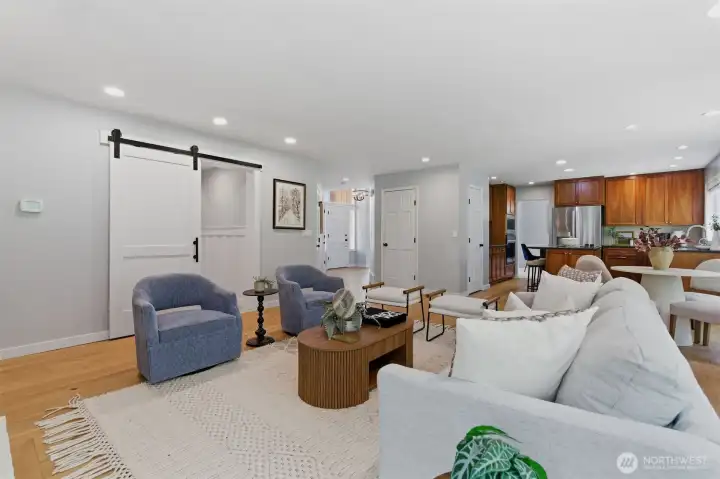 Modern finishes throughout! Barn door is darling way to keep garage entrance private.
