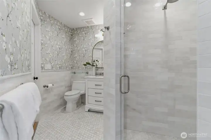Beautiful main floor 3/4 bath with walk-in shower.