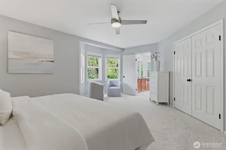 Primary suite includes a 5-piece bath with heated floors, soaking tub and walk in closet.