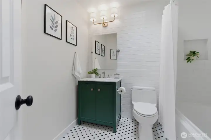 Upstairs hall bathroom with skylight and bathtub.