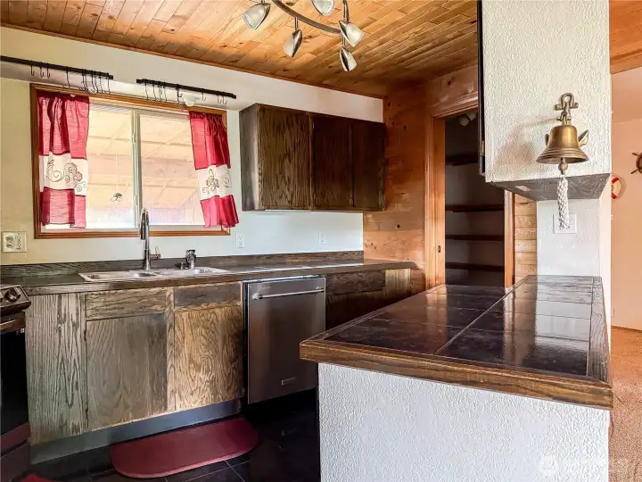 Kitchen has large pantry in the back