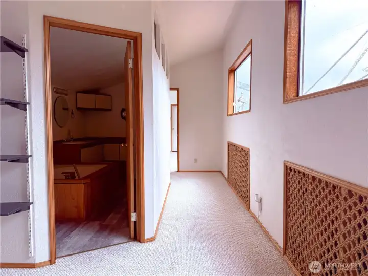 Upstairs loft and hallway to primary