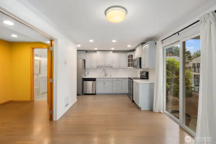 View of dining area off of kitchen and office/flex room with 1/2 bath.