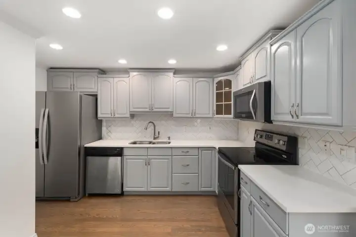 Canned lighting, stainless appliances.