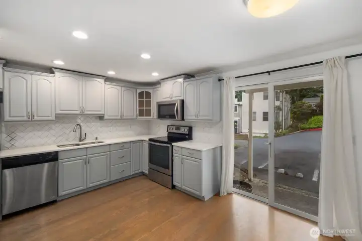 Sliding door faces north, small patio as you exit.