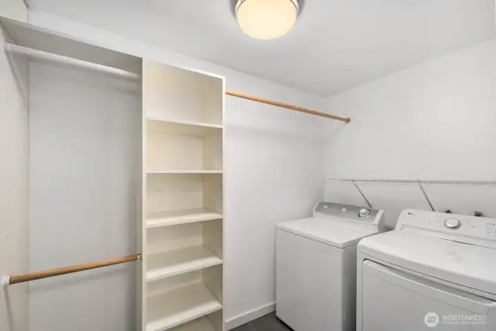 Primary closet holds water heater and full size w/dryer.