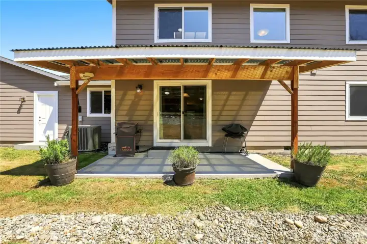 Covered patio right off the kitchen makes grilling convenient Covered patio right off the kitchen makes grilling convenient