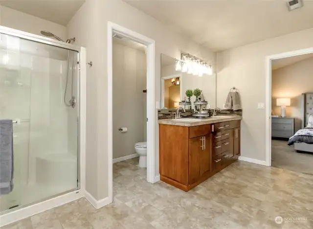 Walk-in shower with separate toilet space in Primary Bath