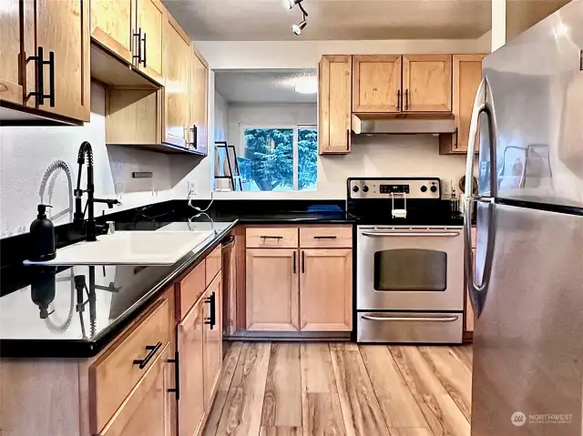 Updated kitchen with quartz countertops.