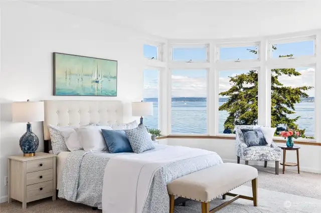 The primary bedroom offers the same expansive bay windows as the living room. How often can you take in views of Mt Rainier from your bedroom?!