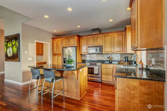 Island Bar With Sitting Area And Walk-through Pantry.