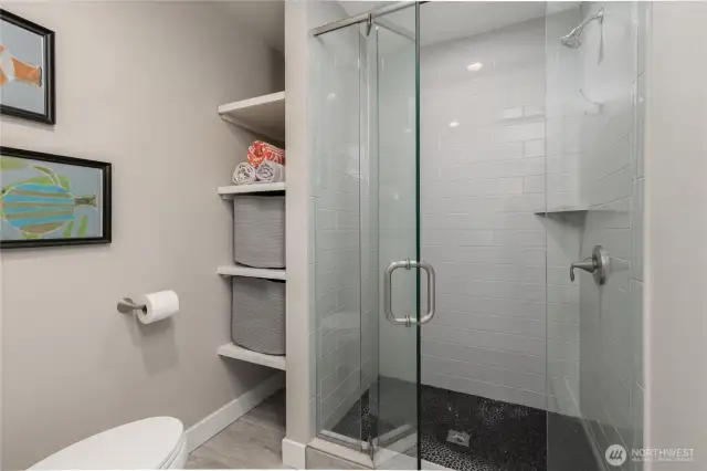 Tiled shower in the upstairs bathroom