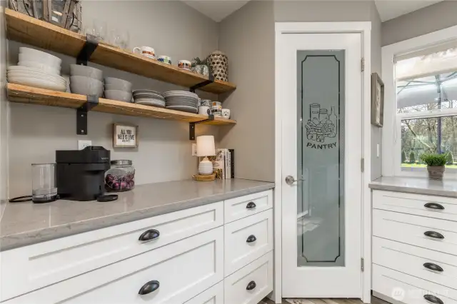 Walk-in pantry and a perfect countertop for your coffee bar