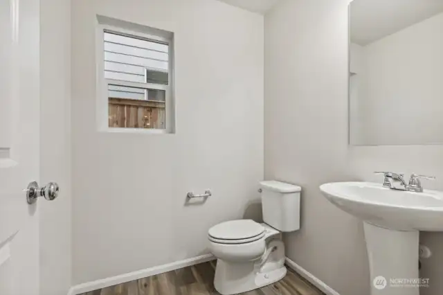 1/2 bath on main-Disclaimer- Photos are of another Warren-2448 floor plan from a previous community, photos are for illustrative purposes only. Finishes, flooring, upgrades, or other features may vary.