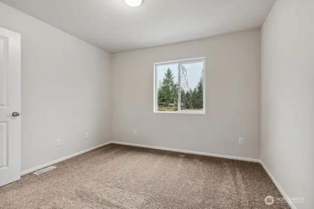 Bedroom #3-Disclaimer- Photos are of another Warren-2448 floor plan from a previous community, photos are for illustrative purposes only. Finishes, flooring, upgrades, or other features may vary.
