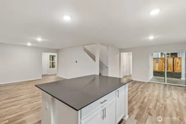 Open Concept Living/Dining Kitchen-Disclaimer- Photos are of another Warren-2448 floor plan from a previous community, photos are for illustrative purposes only. Finishes, flooring, upgrades, or other features may vary.