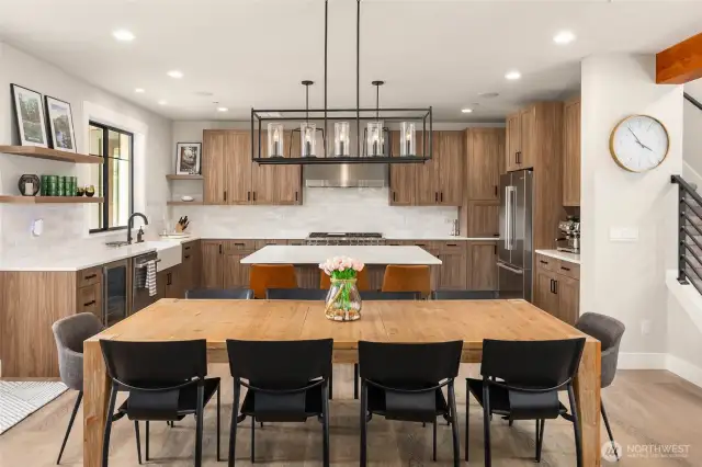 Polished kitchen with Wolf range, quartz counters, a beverage refrigerator, walk-in pantry. And so much storage!
