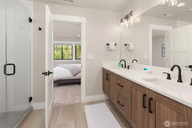 Dual vanities and large walk-in closet.